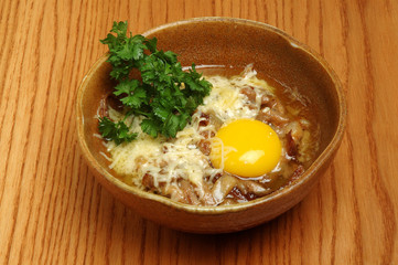 Japanese ramen soup with tofu and egg on wooden background. Miso soup with ramen noodles in ceramic bowl, asian traditional food.