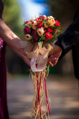 Bride and groom holding hands