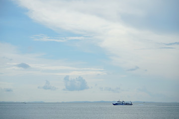 ocean ferrys with beautiful cloudy sky