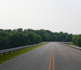 In the middle of a empty road in the countryside. 
