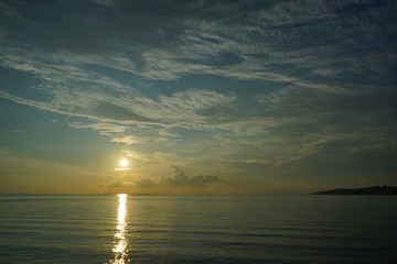 Sunset and sunrise with dramatic sky over ocean with cloudy sky