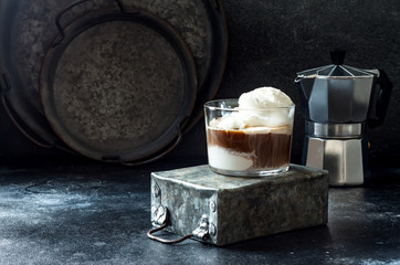 Affogato coffee with vanilla ice cream. Summer coffee drink with ice cream and espresso in the glass