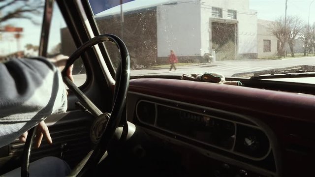 Man Driving Vintage Pickup Truck. Side View. Close Up.