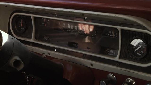 Old Car Interior with Retro Red Dashboard. Close-Up.