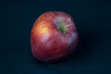 Red Apple on black background. Fruits. Healthy diet.