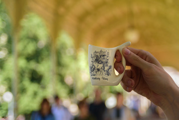 Man holding special mug, Karlovy Vary