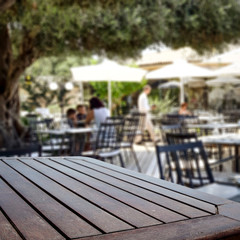 Table background  in a restaurant outdoor view. Empty  space for your decoration and an advertising product.