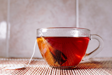 Fototapeta premium tea in a clear glass black