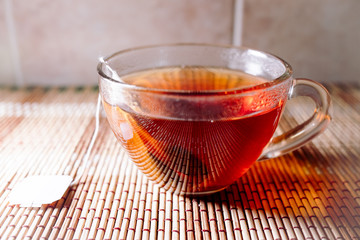 Fototapeta premium tea in a clear glass black