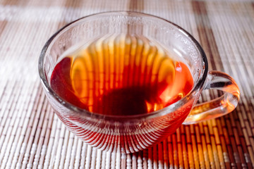 tea in a clear glass black