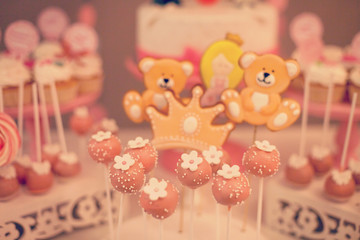 Cake pops pink on candy bar holder. Party sweets.