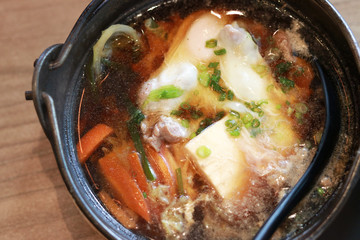Sukiyaki served in hot pot in Japanese restaurant