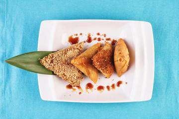 Uzbek cuisine, Central Asian dish. Tandoor samsa-layered dough, pieces of beef, onions, fat tail, baked in the tandoor-Uzbek national clay oven