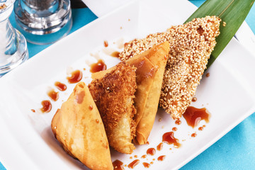 Uzbek cuisine, Central Asian dish. Tandoor samsa-layered dough, pieces of beef, onions, fat tail, baked in the tandoor-Uzbek national clay oven