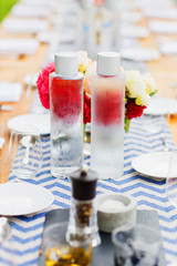 Outdoors picnic. Fresh, cold water stands on the table