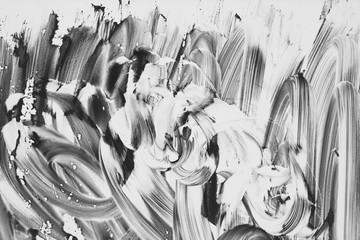 Beautiful abstract paint strokes gouache on white paper in black and white for the background 