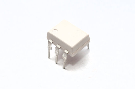 An optocoupler (or opto-isolator) electronic component on white background
