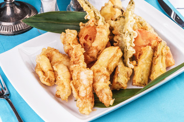 European cuisine, Mediterranean dish. Whole crab legs, crab meat fried in batter on butter, beer snack with creamy mustard sauce