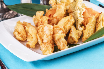 European cuisine, Mediterranean dish. Whole crab legs, crab meat fried in batter on butter, beer snack with creamy mustard sauce