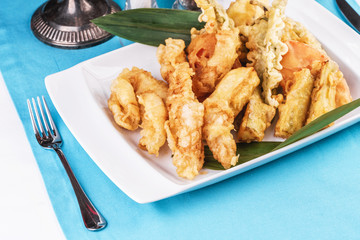 European cuisine, Mediterranean dish. Whole crab legs, crab meat fried in batter on butter, beer snack with creamy mustard sauce