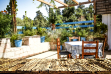 Table background  in a garden outdoor view. Empty space for your decoration and an advertising product.