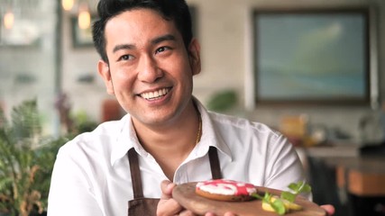 Asian chef checking up his food before serve, lifestyle concept.