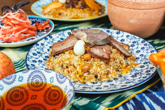 Andijan sweet pilaf with beef, quail egg, chickpeas and raisins according to Uzbek recipe