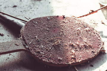 very old and dirty abandoned table tennis racket