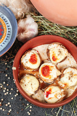 Baked mushrooms in the oven in their own juice with Georgian style cheese and chicken in Georgian style. National cuisine