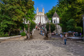 Obraz premium Braga, Portugal. Bom Jesus do Monte Sanctuary Basilica on top with Staircase of Five Senses and Staircase of Virtues on foreground. Cobblestone ornate pavement