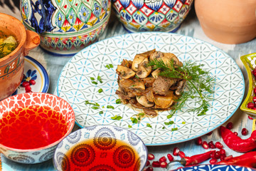 Beef with mushrooms, onion, fried in oil according to Uzbek recipe.