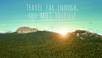 Travel far enough, you meet yourself - inspiration quote on natural mountain landscape. picturesque...