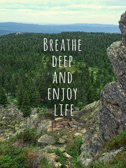 Breathe deep and enjoy life - inspiration quote on natural mountain landscape. picturesque view of mountain, theme for travel backdrop design card. soft focus © Ju_see