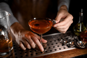 Close-up of alcohol cocktail with olive inside