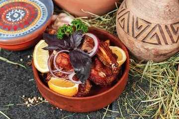 Georgian chicken stew with vegetables, greens, lemon and onions in Georgian. National cuisine