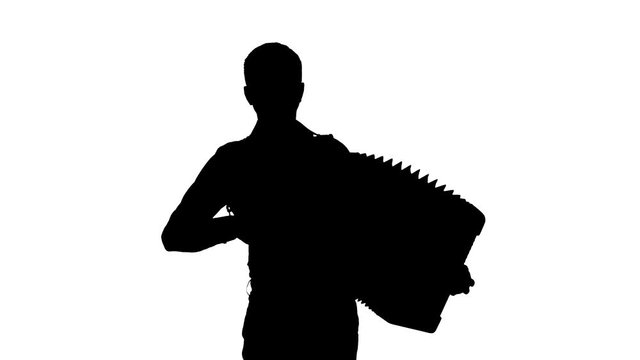 man musician plays the accordion masterly in the studio, black silhouette on a white background,isolated,close-up