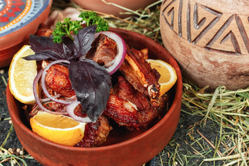 Georgian chicken stew with vegetables, greens, lemon and onions in Georgian. National cuisine