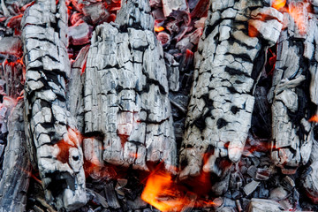 Burning firewood. Hot coals close up