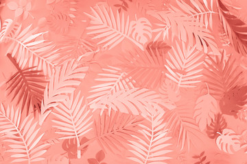 Fototapeta na wymiar top view of coral tropical paper cut palm leaves, minimalistic background