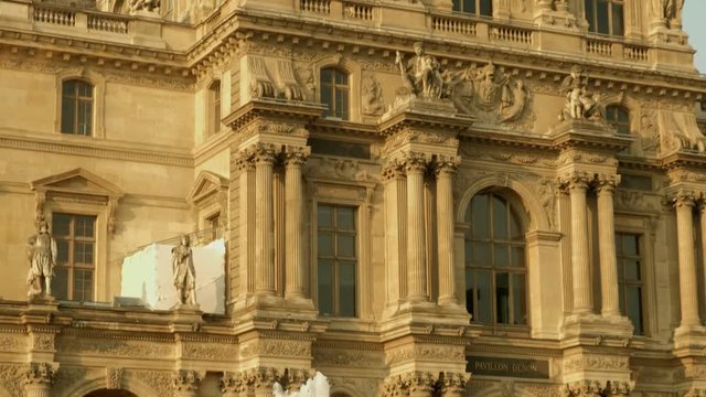 Tilt down the Facade of the Pavilion Denon at The Louvre in Paris, France