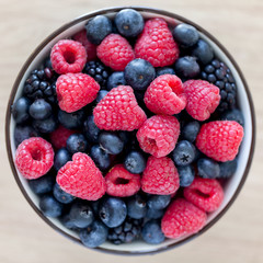 Bowl of fresh organic berries. Healthy breakfast option. View from above.