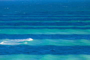 Turquoise and blue stripes in the ocean in Miami