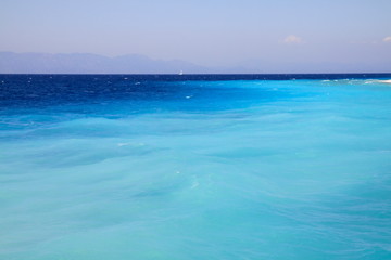 Turquoise beautiful waters of the Aegean Sea in the city of Rhodes