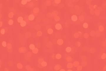 Coral tone bokeh blurred background. Abstract creative pink bokeh background