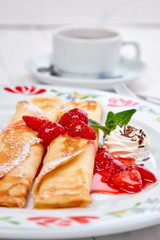 crepes with strawberry sauce and whipped cream