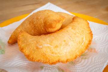 Delicious fried panzerotto on a plate. Traditional food of Puglia, Italy