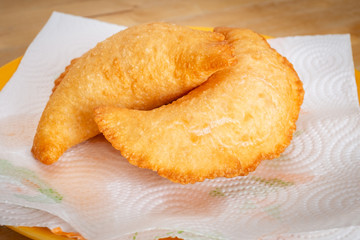 Delicious fried panzerotto on a plate. Traditional food of Puglia, Italy