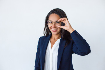 Beautiful young businesswoman in spectacles. Portrait of attractive happy young woman in formal...