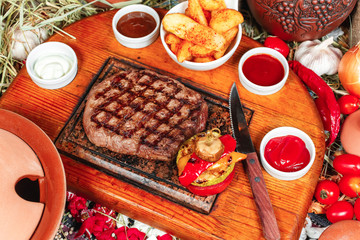  Grilled steak with sauces, fresh vegetable salad and mashed potatoes Georgian recipe. National cuisine