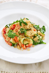 An easy, zesty summer salad with a Mediterranean flair featuring Israeli couscous and chopped summer vegetables